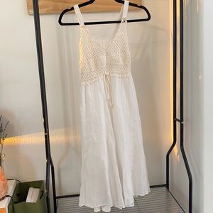 White dress with crochète detailing.